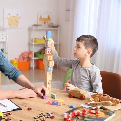 Man and boy playing with blocks